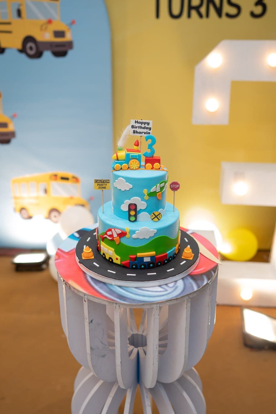 School-bus themed two-tier birthday cake